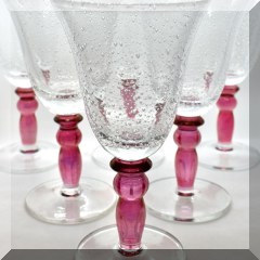G21. 12 bubble glass goblets with red stems 8”h - $48 